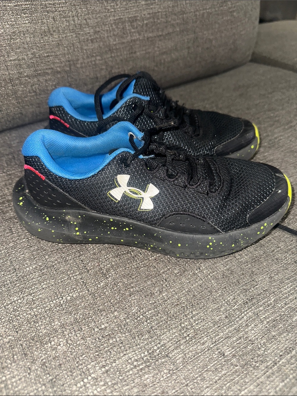 Under Armour Kids Black Sneakers with Blue Lining and Neon Green Speckle